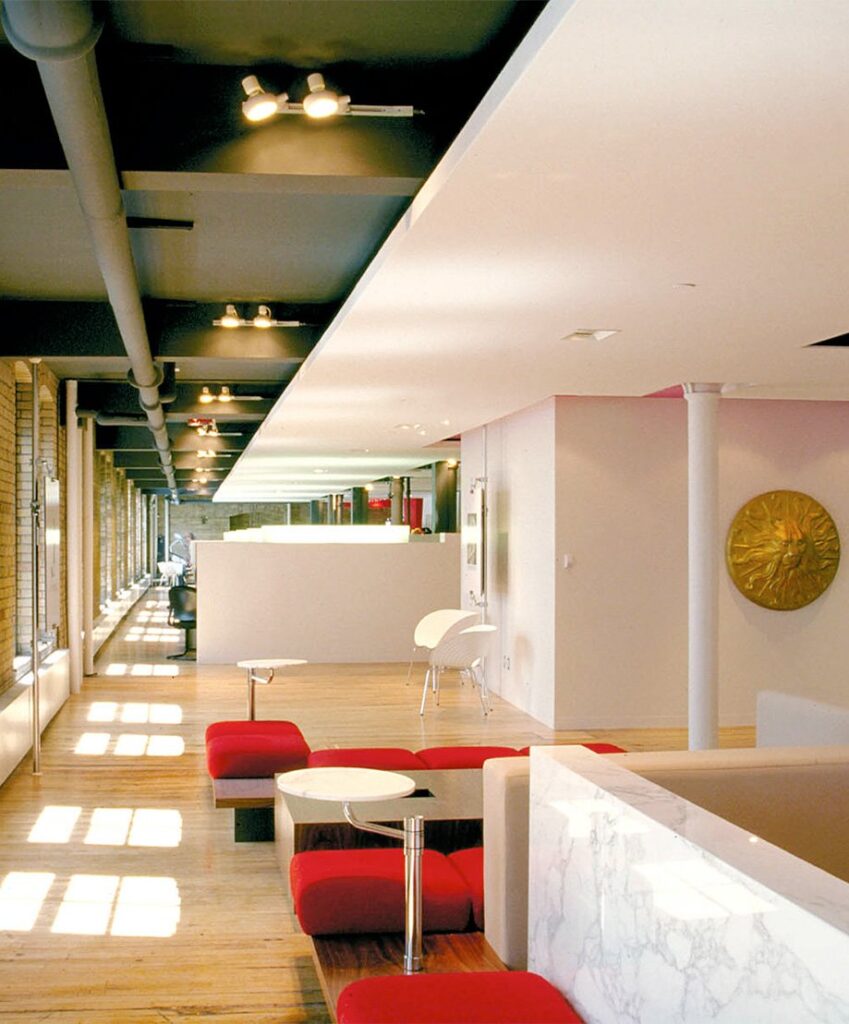 Publicis Toronto main lobby, office cubicles in the background, lounge seating and front desk in the foreground.