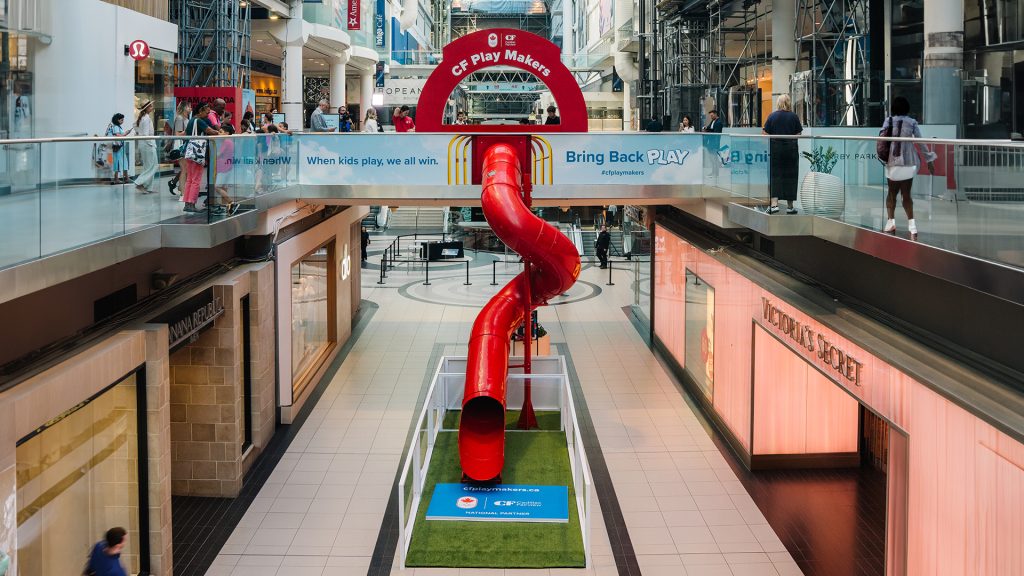 Eatons centre with a red slide leading from the pedestrian walkway